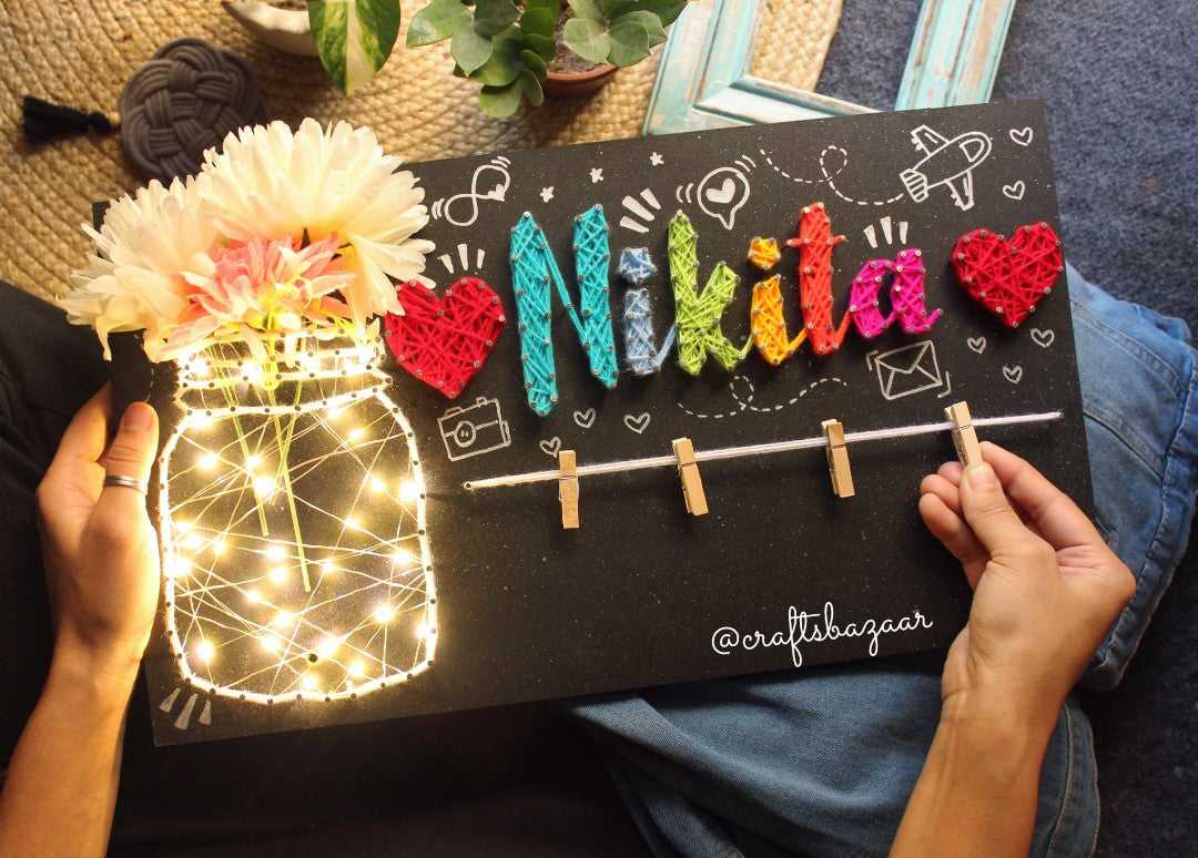 lighted string art with hand